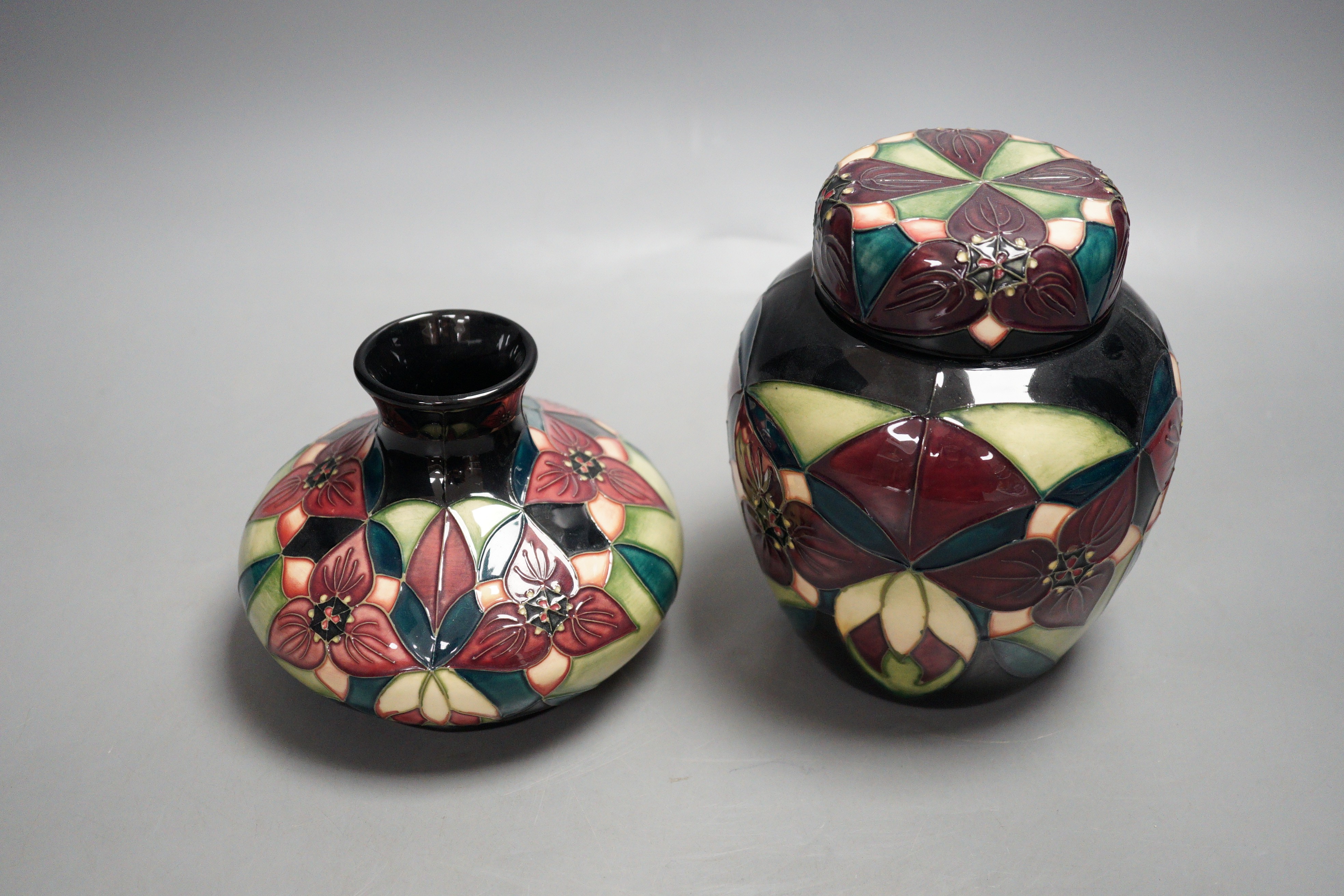A Moorcroft pottery squat shaped vase and lidded ginger jar, decorated in the 